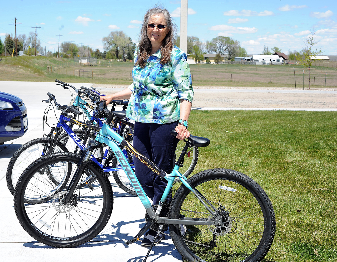  Kim Evezich with bikes for EWC international students
