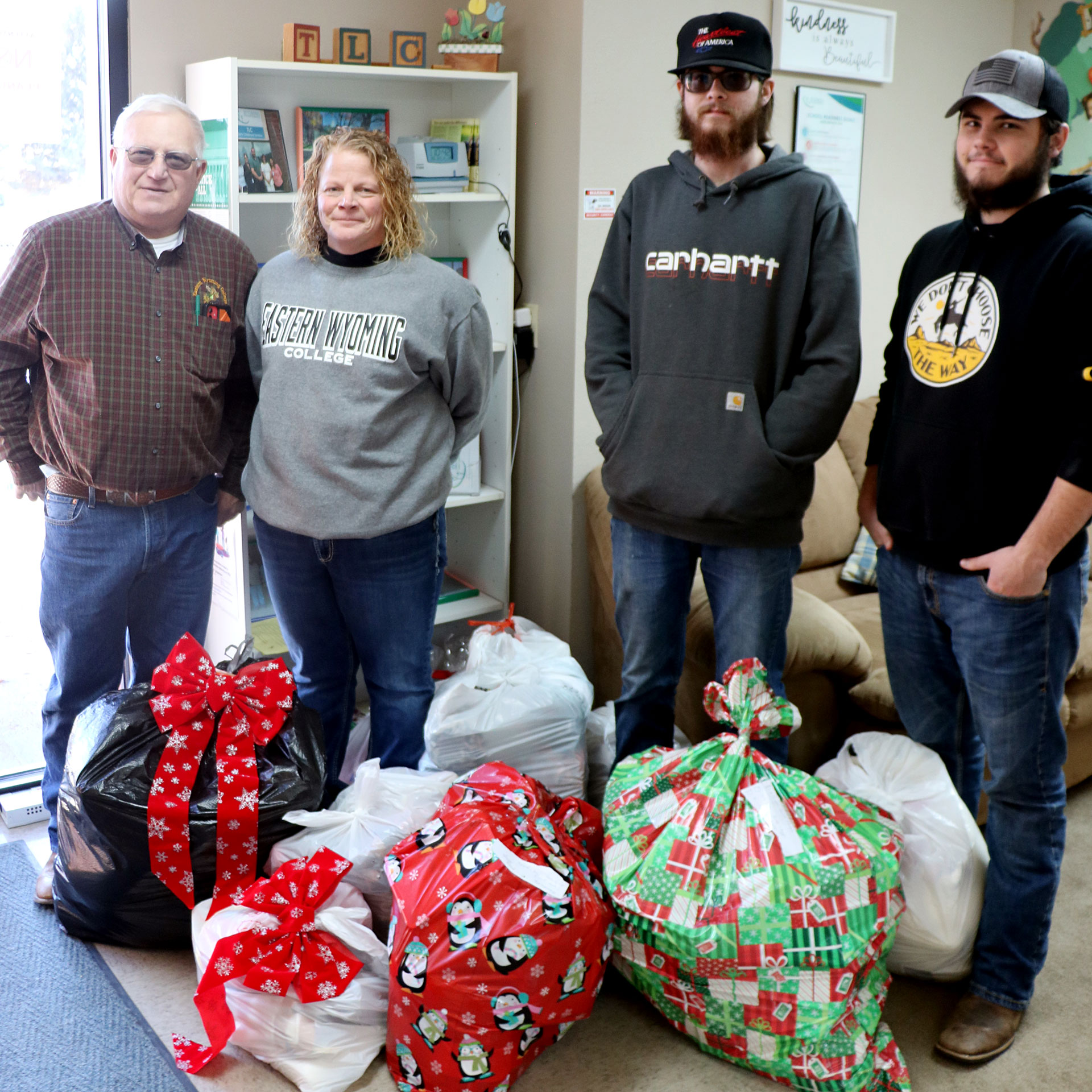 EWC SkillsUSA members delivered bags of toys, bears, and blankets to the Torrington Learning Center (TLC). Left to right: Stan Nicolls, Kim Russell, sponsors, SkillsUSA members Reece Cook, and Dylan Offutt.