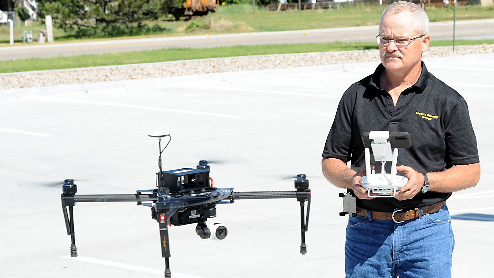 Eastern Wyoming College professor Matt Scott flies a DJI Matrice 100 drone.  It is an expandable platform drone that can have different payloads or sensors added to it to increase its versatility. drone on the EWC campus. Drones allow for more detailed data making the decisions needed for those working in the field of precision agriculture.